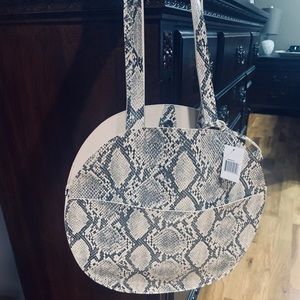 Round snakeskin print bag